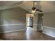 Bright living room with vaulted ceiling, modern paint, wood-look flooring, and decorative chair rail at 284 Irvan St, Clayton, NC 27520