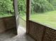 View from the screened porch to a lush green backyard at 284 Irvan St, Clayton, NC 27520