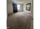 Comfortable bedroom with plush carpeting and natural light from the window at 304 Culvert St, Apex, NC 27502