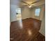 Inviting living room with hardwood floors and a ceiling fan for added comfort at 304 Culvert St, Apex, NC 27502