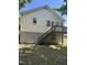 Rear view of house with stairs and deck providing outdoor space at 304 Culvert St, Apex, NC 27502