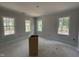 Spacious bedroom with abundant natural light streaming through large windows and neutral walls at 328 Green Pines Estates Dr, Kenly, NC 27542