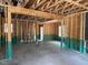 View of the interior of a new construction home with exposed wood framing and concrete flooring at 328 Green Pines Estates Dr, Kenly, NC 27542