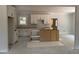 An unfinished kitchen features white cabinets and a center island frame, offering a customizable space at 328 Green Pines Estates Dr, Kenly, NC 27542