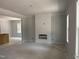 An unfinished living room features a modern fireplace accent wall and ample natural light from a large window at 328 Green Pines Estates Dr, Kenly, NC 27542