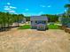 The home has a spacious green backyard and is bordered by a lush line of trees at 355 Beacon Hill Rd # 23, Lillington, NC 27546