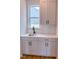 Wet bar features quartz countertops, subway tile backsplash, and shaker style cabinets at 355 Beacon Hill Rd # 23, Lillington, NC 27546