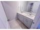 Bathroom with double sink vanity, light gray cabinets, and tile flooring, offering a modern aesthetic at 355 Beacon Hill Rd # 23, Lillington, NC 27546