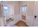 Powder room featuring wood-look floors, paneled wall accents, and a pedestal sink at 355 Beacon Hill Rd # 23, Lillington, NC 27546