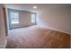 An upstairs bedroom with two windows and neutral carpet at 355 Beacon Hill Rd # 23, Lillington, NC 27546