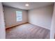 Bedroom features a window with natural light and plush carpeting at 355 Beacon Hill Rd # 23, Lillington, NC 27546