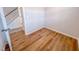 Bedroom featuring wood-look floors and a view of the hallway and staircase at 355 Beacon Hill Rd # 23, Lillington, NC 27546
