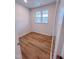 Small bedroom with wood-look floors, a double window, and neutral wall paint at 355 Beacon Hill Rd # 23, Lillington, NC 27546