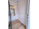 Inviting entryway with paneled wall accents, wood-look flooring, and a glass front door at 355 Beacon Hill Rd # 23, Lillington, NC 27546
