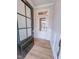 Inviting entryway with paneled wall accents, wood-look flooring, and a glass front door at 355 Beacon Hill Rd # 23, Lillington, NC 27546