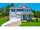 Charming two-story home with a well-manicured lawn and a classic architectural style at 355 Beacon Hill Rd # 23, Lillington, NC 27546