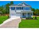Charming two-story home with a well-manicured lawn and a classic architectural style at 355 Beacon Hill Rd # 23, Lillington, NC 27546