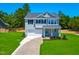 Two-story home boasts a manicured lawn and a two-car garage at 355 Beacon Hill Rd # 23, Lillington, NC 27546
