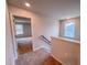 Upstairs hallway with carpet and natural light from two windows at the end of the hall at 355 Beacon Hill Rd # 23, Lillington, NC 27546