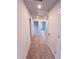 Hallway view featuring neutral walls, plush carpeting, and white doors leading to various rooms at 355 Beacon Hill Rd # 23, Lillington, NC 27546