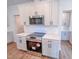 New kitchen features stainless steel appliances, white cabinets, and subway tile backsplash at 355 Beacon Hill Rd # 23, Lillington, NC 27546