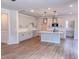 Bright kitchen featuring hardwood floors, an island, and stainless steel appliances at 355 Beacon Hill Rd # 23, Lillington, NC 27546