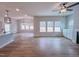 Open floorplan featuring hardwood floors, large windows, and a ceiling fan at 355 Beacon Hill Rd # 23, Lillington, NC 27546