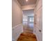 Bright living room features hardwood floors, and many windows overlooking a wooded area at 355 Beacon Hill Rd # 23, Lillington, NC 27546