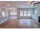 Open floorplan featuring hardwood floors, large windows, and a ceiling fan at 355 Beacon Hill Rd # 23, Lillington, NC 27546