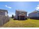 Fenced backyard view with a screened-in porch at 3629 Brittlebank Dr, Raleigh, NC 27610