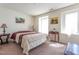 Bright bedroom featuring two windows, and decorative side tables with lamps at 3629 Brittlebank Dr, Raleigh, NC 27610