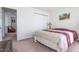 Comfortable bedroom with a large bed, closet, and natural light at 3629 Brittlebank Dr, Raleigh, NC 27610