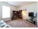 Cozy bedroom featuring warm light and decorative items on shelves at 3629 Brittlebank Dr, Raleigh, NC 27610