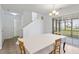 Bright dining area with table, chairs, and sliding glass doors to the outdoors at 3629 Brittlebank Dr, Raleigh, NC 27610