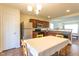 Eat-in kitchen boasting stainless steel appliances, wooden cabinets, and views into the living room at 3629 Brittlebank Dr, Raleigh, NC 27610