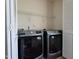 Functional laundry room with modern front-load washer and dryer, plus ample storage space at 3629 Brittlebank Dr, Raleigh, NC 27610