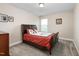 Comfortable bedroom with carpet floors, picture frames on the wall, and a window at 3832 Stovall Dr, Haw River, NC 27258