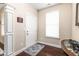 Bright entryway with hardwood floors, a rug, and white door at 3832 Stovall Dr, Haw River, NC 27258