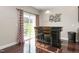 A kitchenette area with hardwood floors, a serving bar, and bar stool seating at 3832 Stovall Dr, Haw River, NC 27258