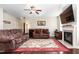 A living room featuring a fireplace, hardwood floors with an area rug, and neutral colored walls at 3832 Stovall Dr, Haw River, NC 27258