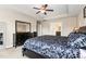Inviting main bedroom features a tray ceiling, a ceiling fan, and a dark wood bedroom set at 3832 Stovall Dr, Haw River, NC 27258