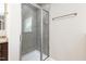 Bright shower showcasing tiled walls, glass enclosure, and modern fixtures at 3832 Stovall Dr, Haw River, NC 27258