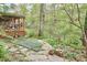 Backyard patio and landscaping with lush green path at 4 The Gln, Chapel Hill, NC 27514