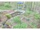 Backyard includes pond with patio and landscaping at 4 The Gln, Chapel Hill, NC 27514