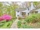Beautiful yard and gardens featuring a charming home with covered porch at 4 The Gln, Chapel Hill, NC 27514