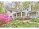 Beautiful home featuring a covered porch and surrounding landscape at 4 The Gln, Chapel Hill, NC 27514