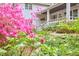 Charming exterior view with a lush garden featuring beautiful pink azaleas at 4 The Gln, Chapel Hill, NC 27514