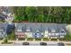 Aerial view of colorful townhomes, parking and green foliage at 433 Triumph Ln, Wake Forest, NC 27587