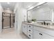 Bathroom featuring double sinks, granite countertops, and a glass-enclosed shower at 433 Triumph Ln, Wake Forest, NC 27587