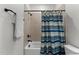 Cozy bathroom featuring a tub, shower with a striped curtain and tile walls at 433 Triumph Ln, Wake Forest, NC 27587